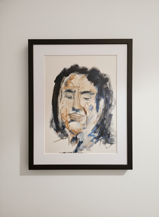 Framed portrait painting of a person on a beige wall