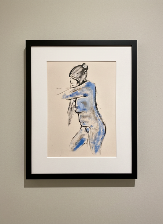 Framed artwork of a nude figure with blue accents on a neutral wall.